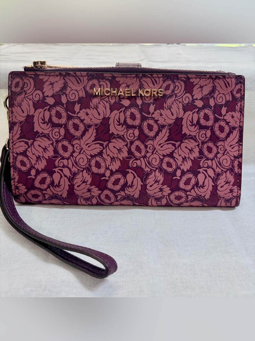 Michael Kors Plum Floral Phone Wristlet Clutch with Gold Logo